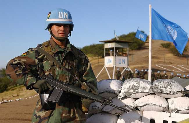 Bolivian Army 2nd Lt. Mauricio Vidangos stands guard at the entry control point of an Observation Point